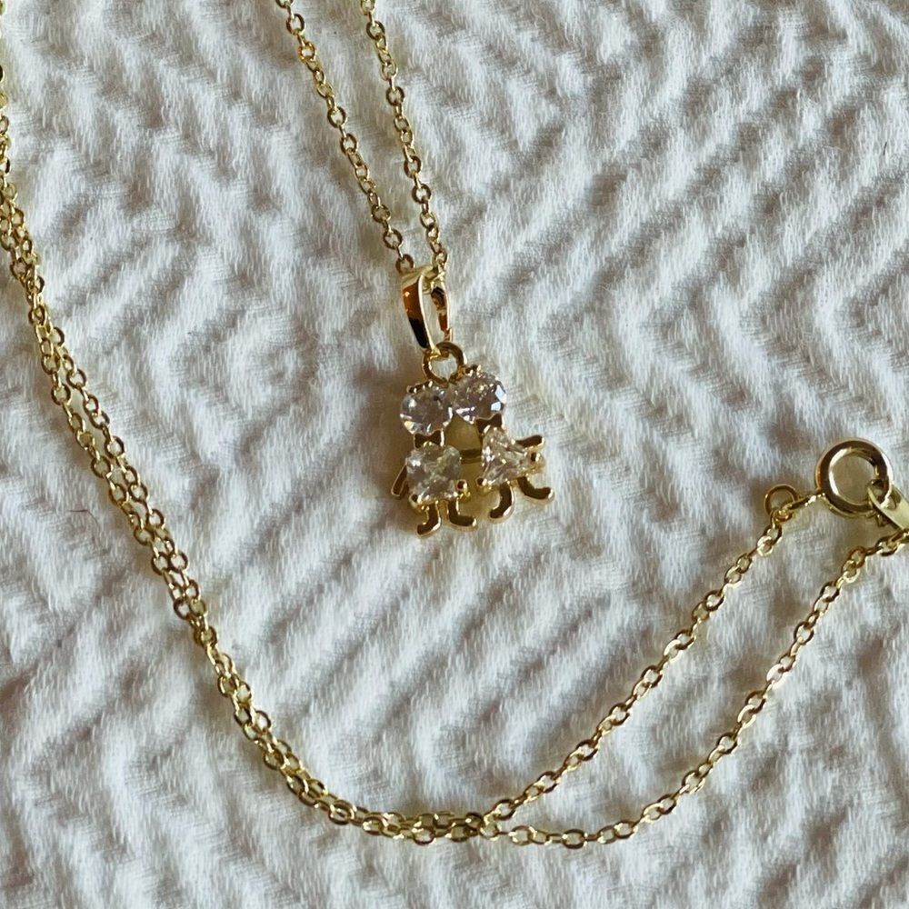 NWOT Gold Girl & Boy, Man & Woman charm necklace